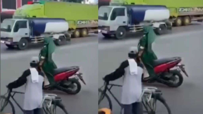 heboh-aksi-emak-emak-ugal-ugalan-naik-motor-sambil-berdiri-ternyata-seorang-odgj_ac44892.jpg