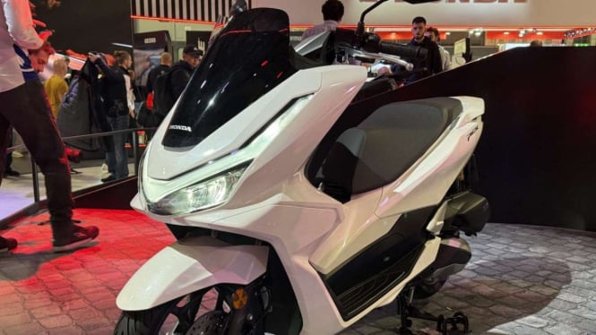 terpopuler-anak-dipukul-polisi-karena-knalpot-canggihnya-fitur-honda-pcx-baru_a6f1597.jpg